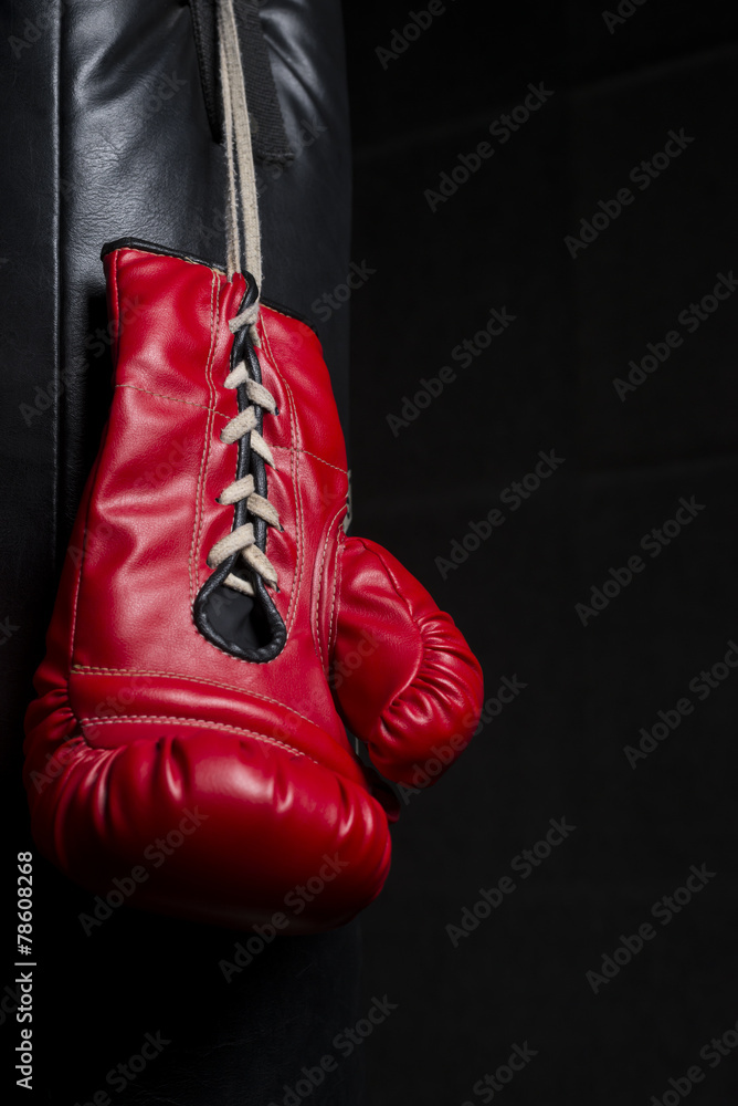 Red boxing glove with low key lighting