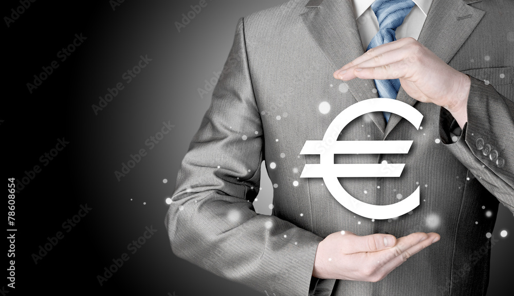 businessman protecting euro symbol