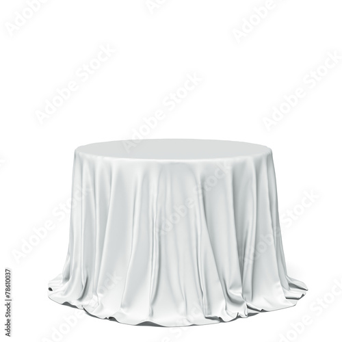 Big white round table and cloth