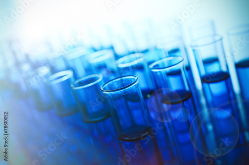Test-tubes with blue fluid, close-up