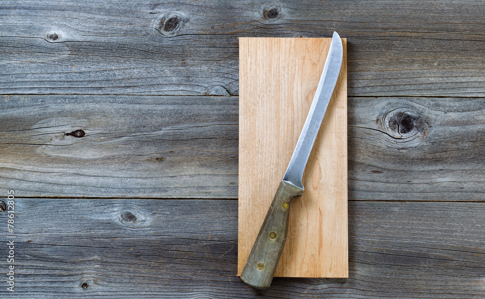 Vintage knife on cutting board