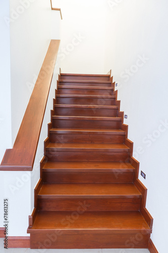 Interior wooden staircase of new house