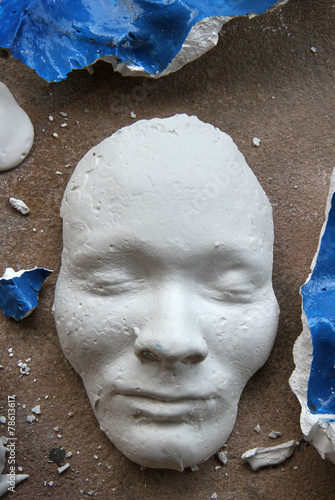 Plaster face mask on the floor