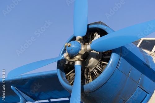 Blue airplane propeller with four blades