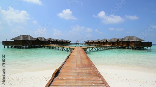Wallpaper Mural Over water bungalows with steps into amazing green lagoon Torontodigital.ca