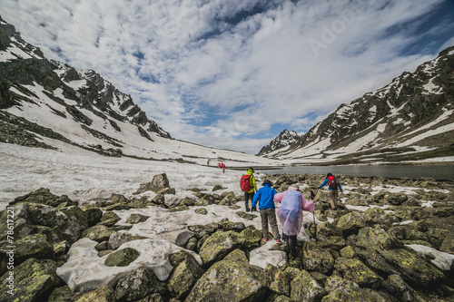 Group of mountaineers walking trough the mountains