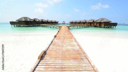Wallpaper Mural Over water bungalows with steps into amazing green lagoon Torontodigital.ca