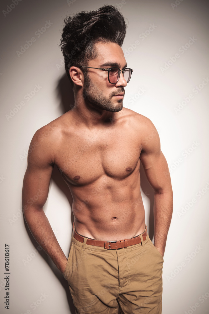 Fototapeta premium sexy man holding both hands in his pocket