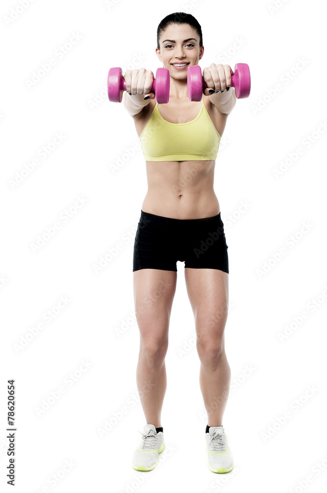 Woman working out with dumbbells Woman working out with dumbbells
