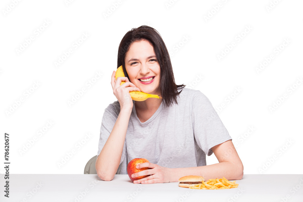 picture of woman with fruits and hamburger in front on white bac picture of woman with fruits and hamburger in front on white bac
