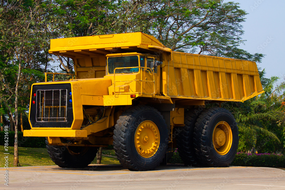 Heavy mining truck in mine and driving along the opencast.