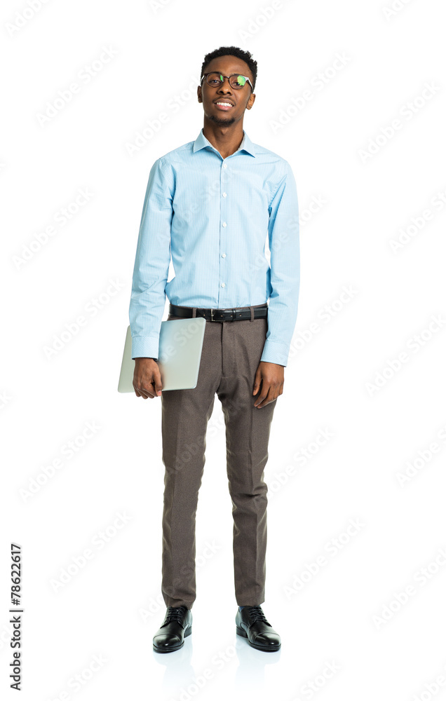 Fototapeta premium Happy african american college student with laptop standing on w