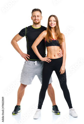 Athletic couple - man and woman after fitness exercise on the wh