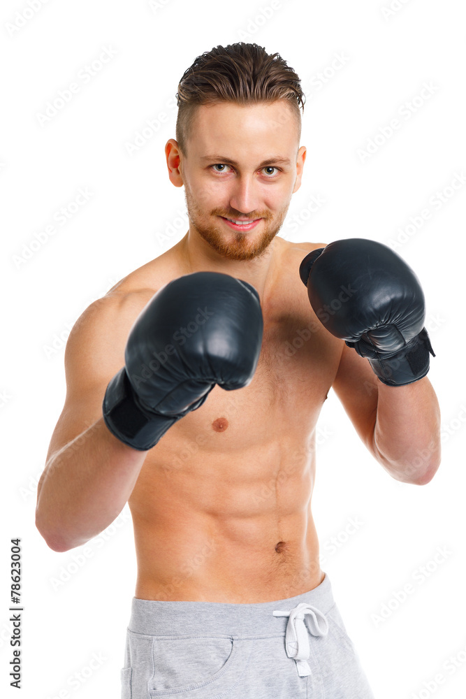 Athletic attractive man wearing boxing gloves on the white Athletic attractive man wearing boxing gloves on the white