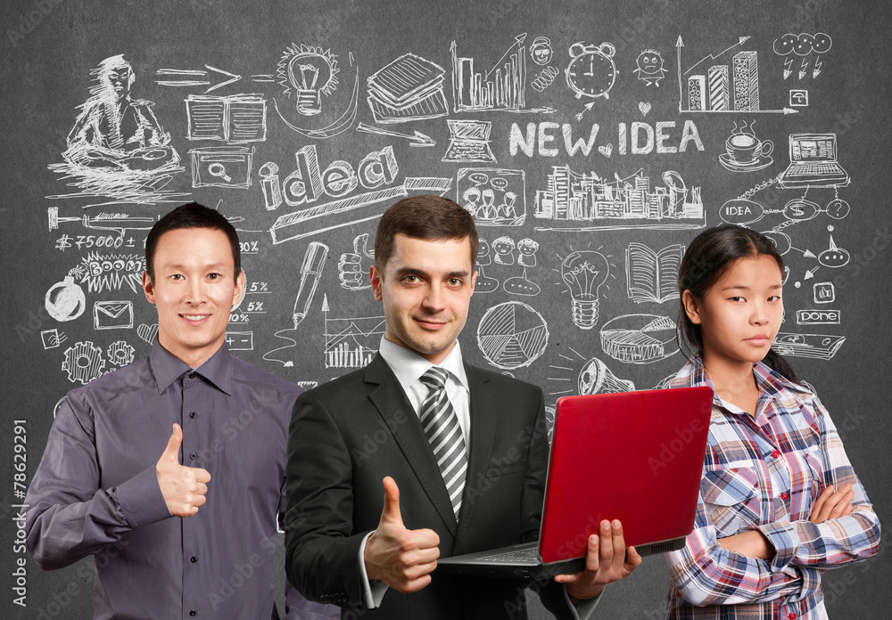Asian team and male in suit with laptop in his hands Asian team and male in suit with laptop in his hands