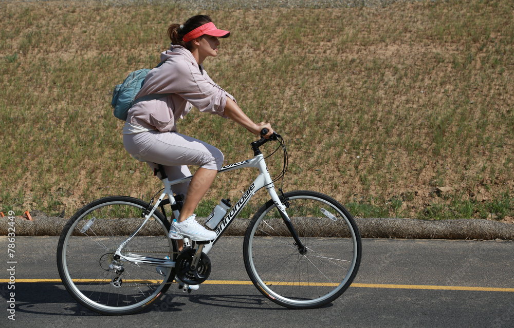 Fototapeta premium woman rides a bicycle