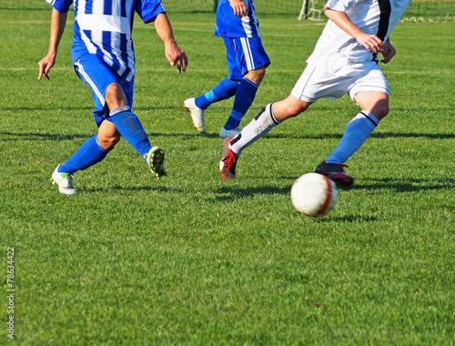 Men are playing soccer