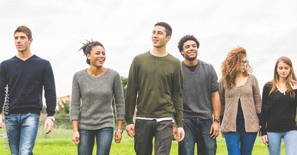 Multiethnic group of friends at park Multiethnic group of friends at park