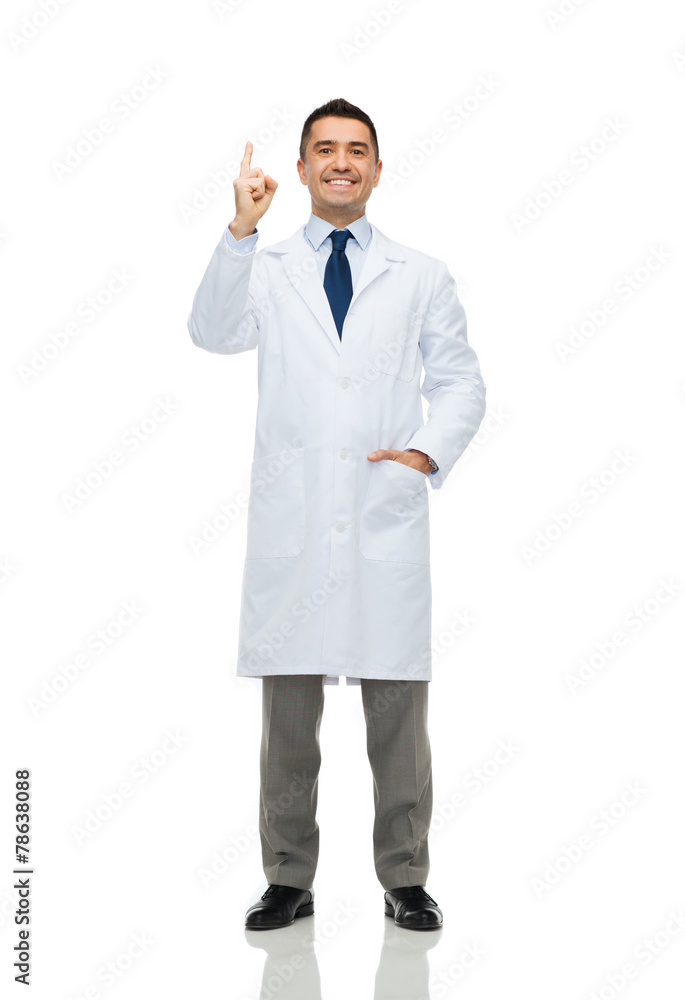 smiling doctor in white coat pointing finger up
