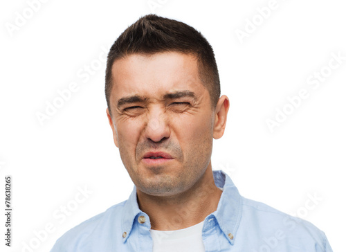 Vászonkép man wrying of unpleasant smell
