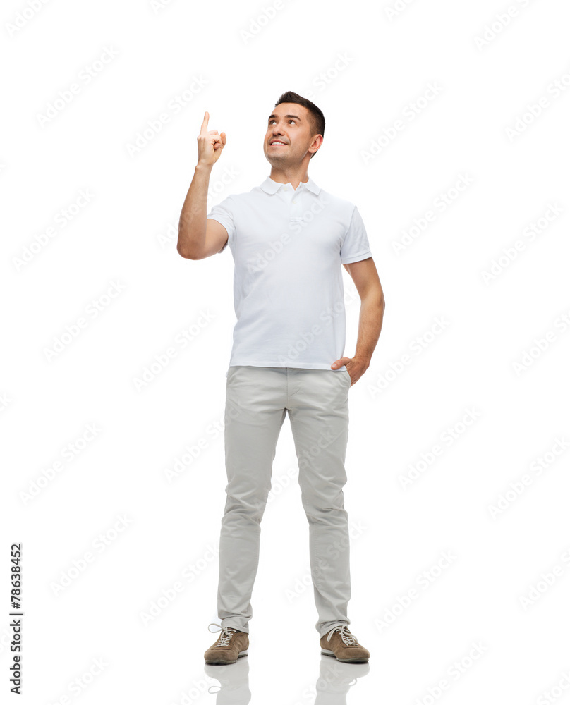 smiling man pointing finger up smiling man pointing finger up
