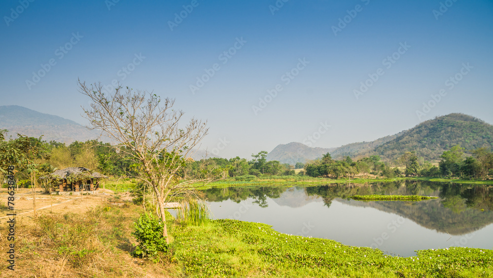 Fototapeta premium Hill front lake with pavilion