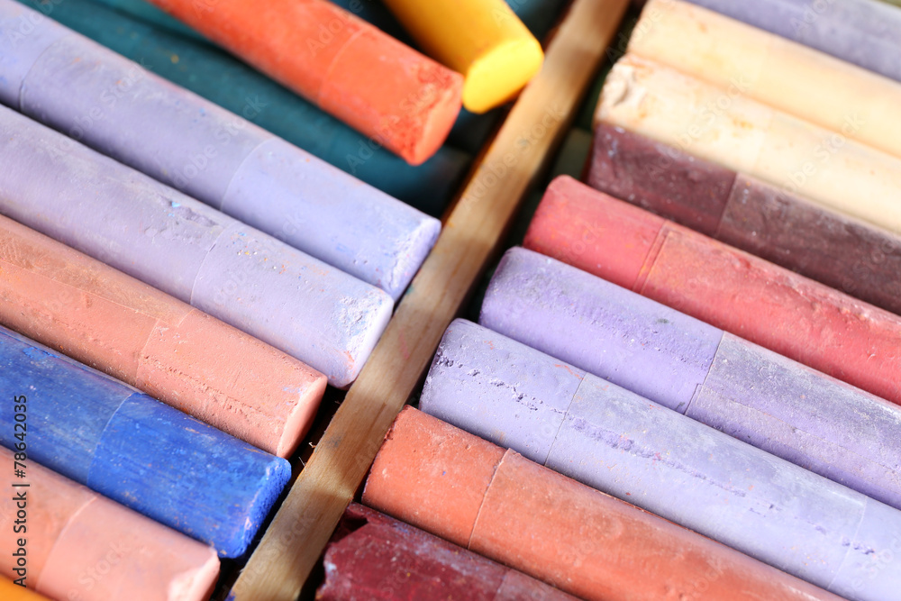 Colorful chalk pastels in box close up Colorful chalk pastels in box close up