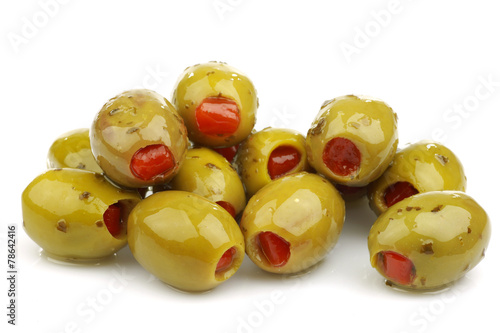 stuffed green olives on a white background
