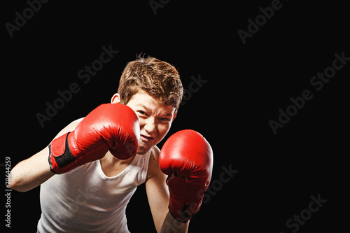 Red-haired boy with gloves © lighthousestock