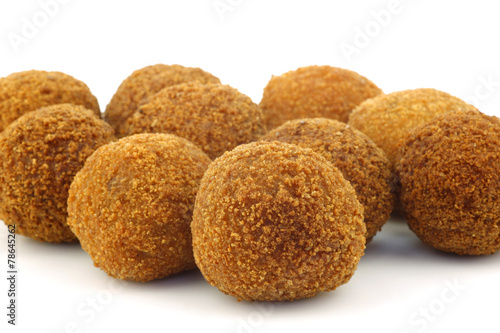  traditional Dutch snack called "bitterballen" on a white backgr
