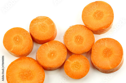 fresh slices of winter carrots on a white background