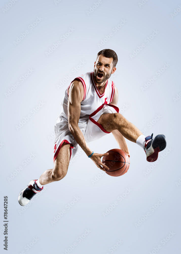Naklejka premium Basketball player is spinning on his finger