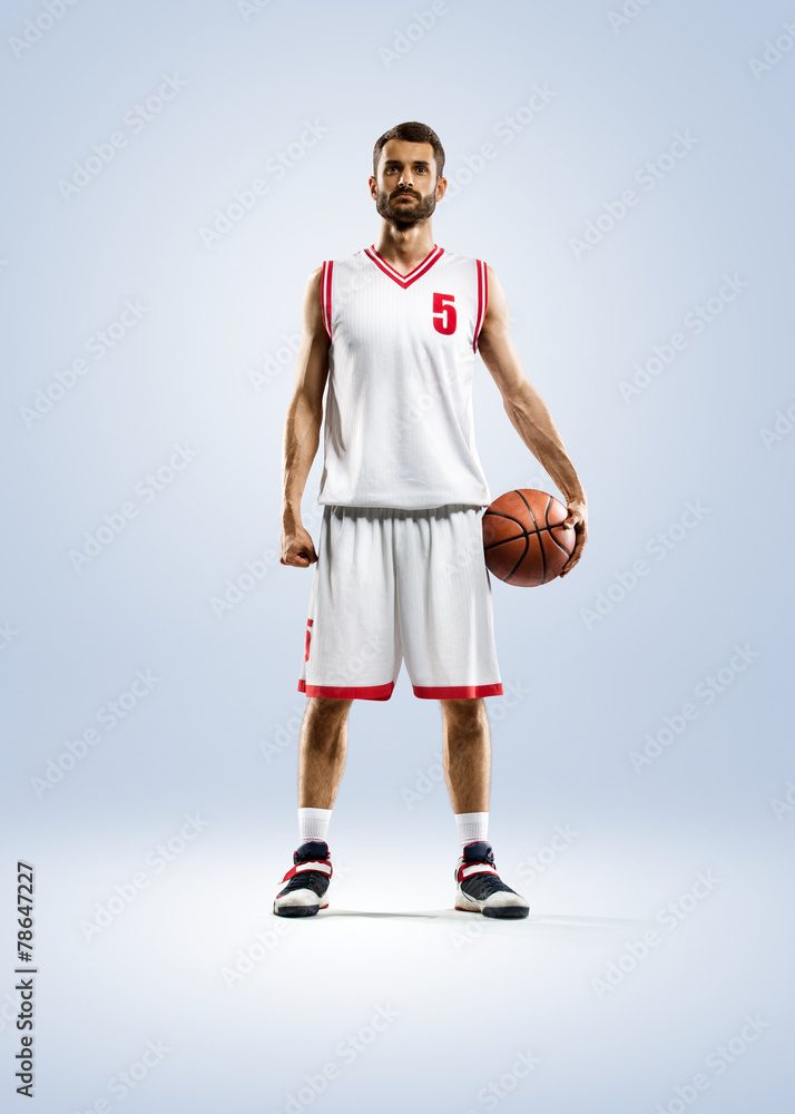 Fototapeta premium Basketball player is spinning on his finger