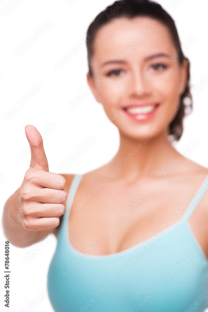 Close up photo of sporty woman showing thumb up Close up photo of sporty woman showing thumb up