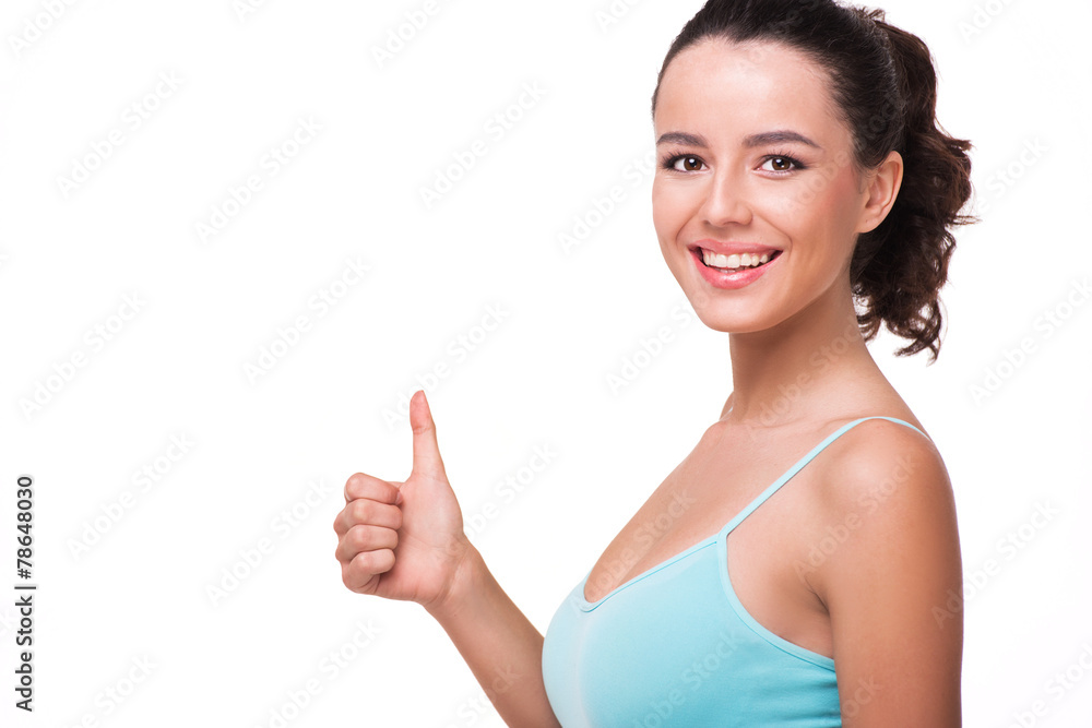 Photo of sporty woman showing thumb up Photo of sporty woman showing thumb up