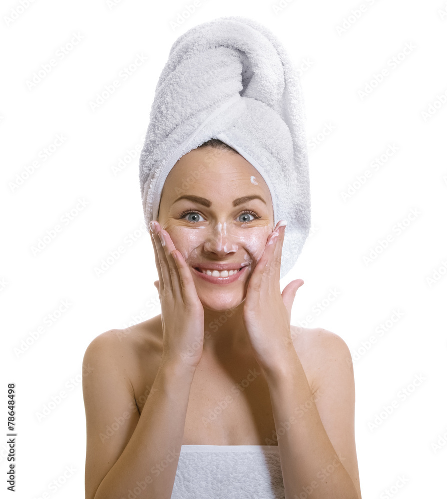 Expresive female after bathing putting cream Expresive female after bathing putting cream