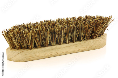 wooden household brush on a white background