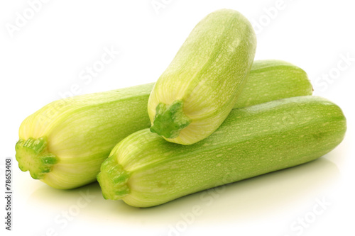light green zucchini (Cucurbita pepo) on a white background
