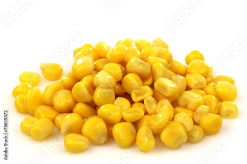 bunch of fresh grains of sweet corn on a white background