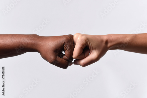 black African American and white Caucasian hands racism concept