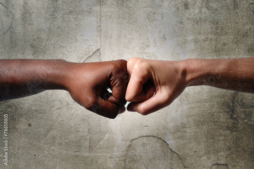 black African American ethnic fist vs white Caucasian