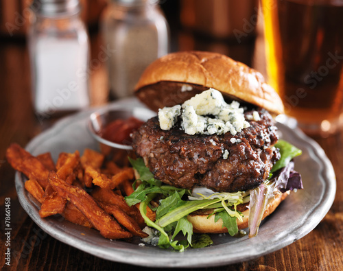 gourmet hamburger with blue cheese with sweet potato fries