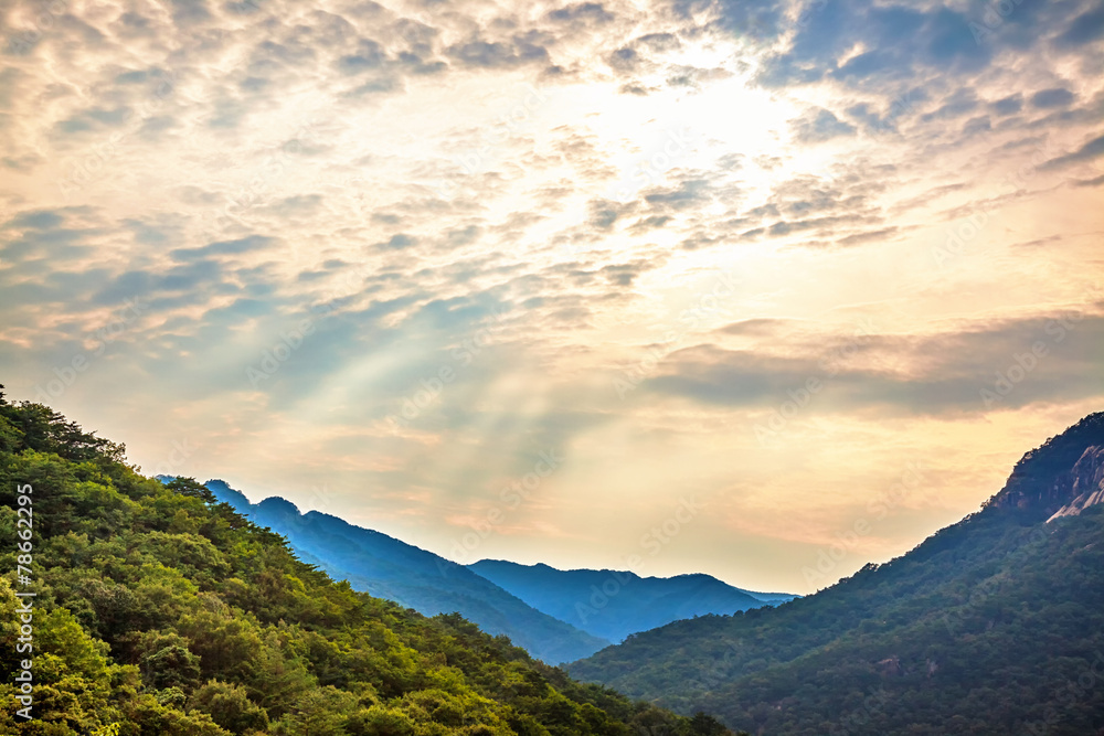 Mountains landscape and cloudy sky with sunbeams in Korea Mountains landscape and cloudy sky with sunbeams in Korea