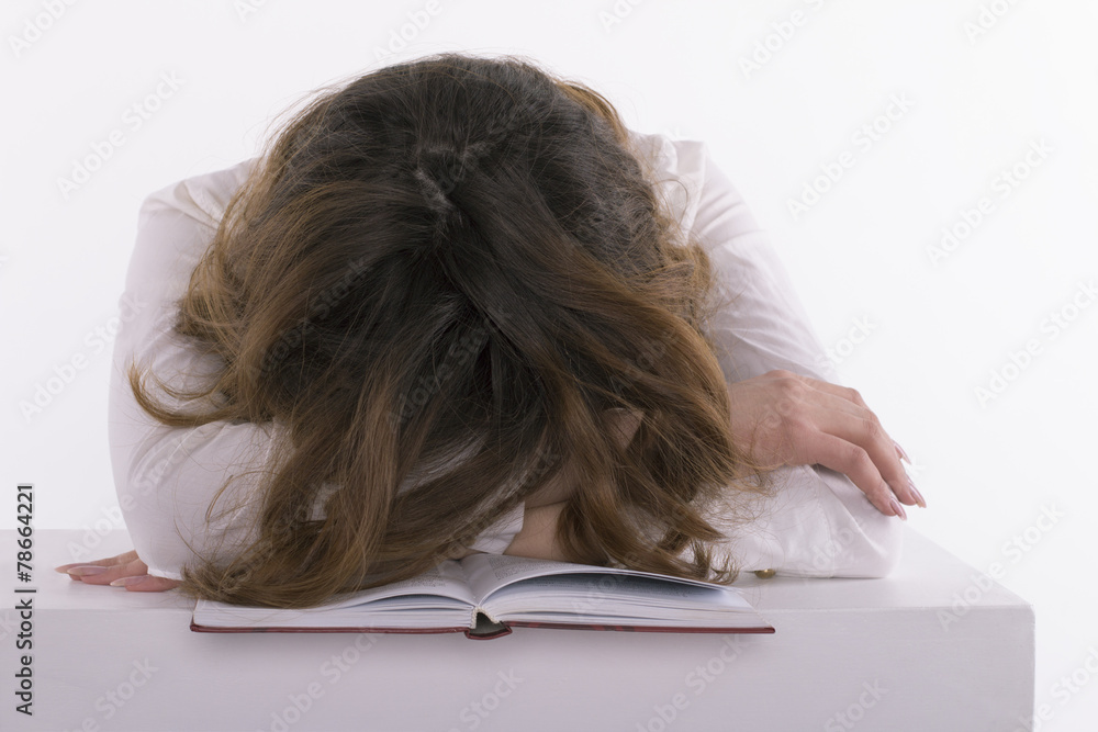 Frustrated student sleeping on the book Frustrated student sleeping on the book