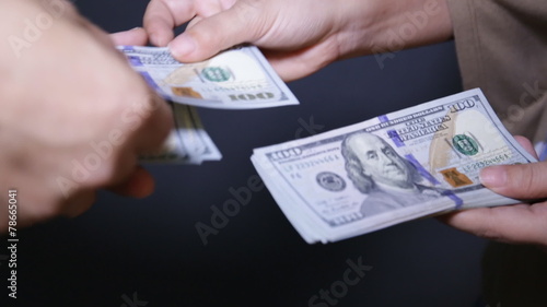Close up of paying cash
