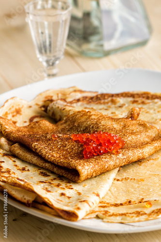 plate of pancakes, ursnoy caviar and glass of vodka