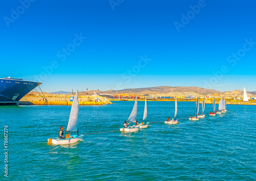 Optimist sailing boats during training at Saronic gulf in Greece