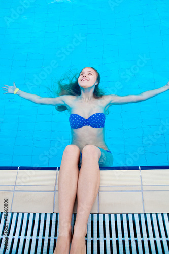 Girl in a pool of water