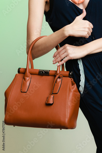 stylish woman fashion girl holding brown handbag