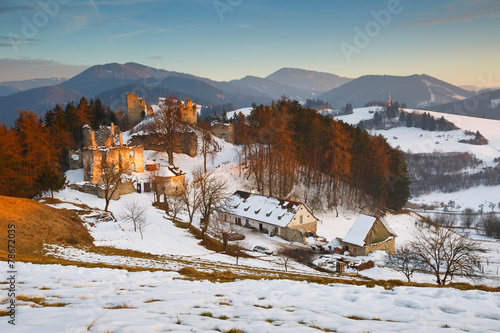 Slovak rural landscape with a ruin of a castle. © milangonda